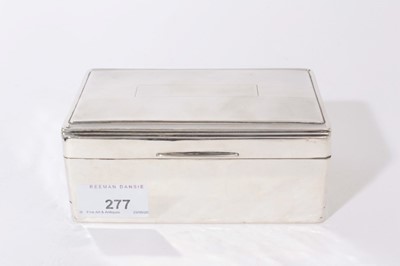 Lot 277 - George VI silver cigarette box of rectangular form, hinged lid with engine turned decoration, opening to reveal cedar lined interior, (Birmingham 1938), Maker, William Neale Ltd, 14.5cm in length