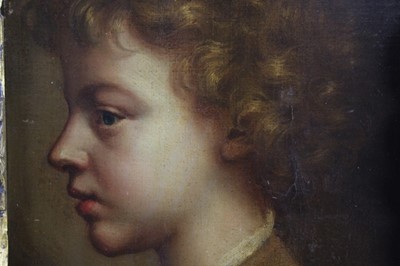 Lot 454 - 18th century, Italian School, oil on canvas - portrait of a young boy in profile, in ornate parcel gilt carved Florentine frame