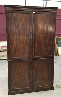 Lot 1332 - Georgian mahogany two height linen press/wardrobe