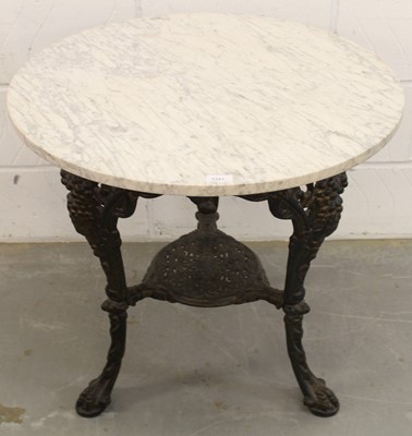 Lot 638 - Victorian cast iron pub table with circular marble top on claw feet 70cm diameter