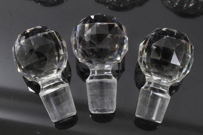 Lot 121 - Set of three Edwardian square cut glass decanters, 22.5cm height