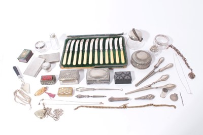 Lot 307 - Set of twelve Edwardian silver butter knives (Sheffield 1902) in a fitted case, together with silver Albert chain, silver topped vanity jars and other silver and white metal items (qty)