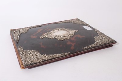 Lot 321 - Victorian leather stationary box with Tortoiseshell and silver mounts, sloped hinged cover opening to reveal fitted interior, together with a similar desk blotter, (London 1892), Maker, William Com...