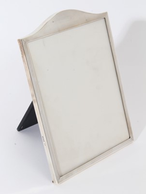 Lot 345 - Good quality large George VI silver photograph frame of rectangular form with arched top and engine turned decoration, with easel support to reverse (London 1948), maker Padgett & Barham Ltd, 30 x...