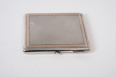 Lot 346 - Good quality George V silver cigarette case of rectangular cushion form with engine turned decoration and gold Greek key border, (Chester 1920), maker Colen Hewer Cheshire, all at 3.5oz, 9cm in len...