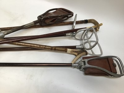 Lot 843 - Collection of assorted sticks to include four shooting stick seats, horn handled stick and two stag horn thumb sticks (7)