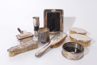 Lot 379 - Continental 925 silver beaker with bark effect signed Kasityo, silver photograph frame, wine coaster,mint dispenser and other silver (9)