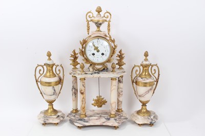 Lot 629 - Late 19th century French ormolu and marble clock garniture comprising drum movement clock with floral swag painted dial , striking on bell , turned columns and floral trophies and pair of matching...