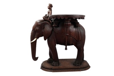 Lot 1369 - Exceptionally fine quality 19th century Indian carved hardwood novelty occasional table in the form of an elephant, with seated rider, removeable tray top, the elephant with finely carved textured...