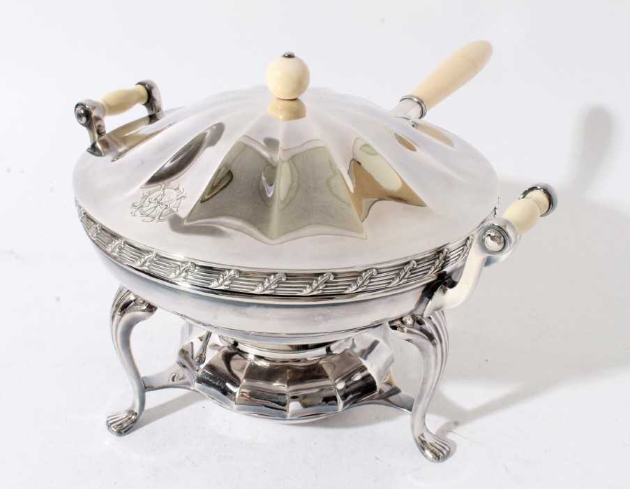 Lot 147 - Early 20th century American silver plated warming dish with ivory handle, push fit cover with ivory ball finial, two handled water container, on stand with integral burner