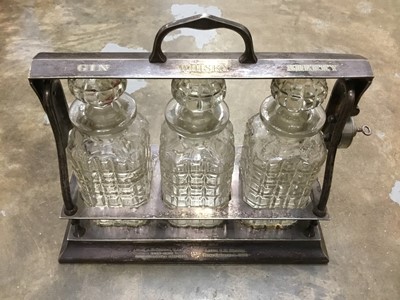 Lot 150 - Early 20th century three bottle tantalus