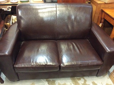 Lot 124 - Brown leather twin seater sofa