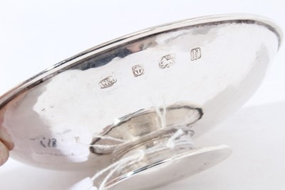 Lot 115 - George V Arts and Crafts silver pin dish of circular form with planished finish on circular foot, (London 1916), maker A. E. Jones