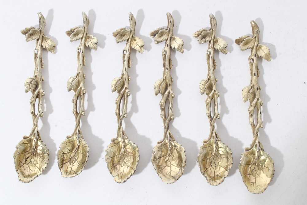 Lot 116 - Set of six good quality white metal cast spoons in the form of branches with leaves, with gilded finish apparently unmarked, all at approximately 3.5oz, each 11.7cm in length