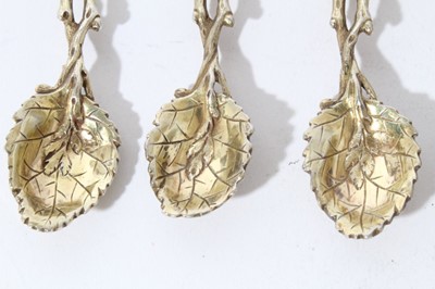 Lot 116 - Set of six good quality white metal cast spoons in the form of branches with leaves, with gilded finish apparently unmarked, all at approximately 3.5oz, each 11.7cm in length