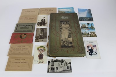 Lot 1176 - Collection of postcards in album and loose including Charlie Chaplin