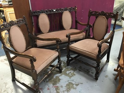 Lot 851 - 1920s oak Carolean revival carved settee and two matching arm chairs with pierced crestings on turned legs