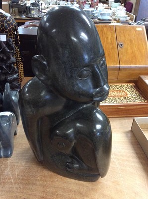 Lot 428 - Contemporary carved hard stone male figure with penguin on his lap