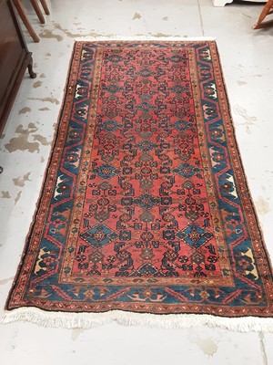 Lot 1053 - Eastern rug with geometric decoration on red and blue ground