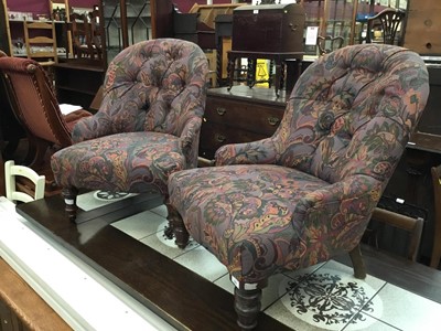 Lot 895 - Two nursing chairs with purple and multi coloured floral scroll upholstery