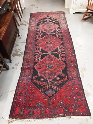 Lot 1049 - Eastern runner with geometric decoration on red and blue ground