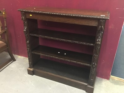 Lot 853 - Victorian carved oak open bookcase with two shelves and human mask and fruit decoration 101cm wide, 96 cm high,35cm deep