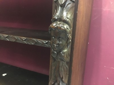 Lot 853 - Victorian carved oak open bookcase with two shelves and human mask and fruit decoration 101cm wide, 96 cm high,35cm deep