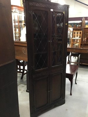 Lot 855 - Ercol style oak corner cabinet with leaded glazed doors and two panelled doors below