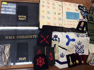 Lot 338 - Royal Navy cloth badges, nautical scrap book and bosun’s whistle