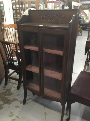 Lot 858 - Edwardian oak china display cabinet with scroll carved ledge back, two glazed doors on splayed front legs 65.5 cm wide, 139 cm high