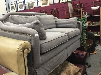 Lot 914 - Two-seater sofa upholstered in grey material