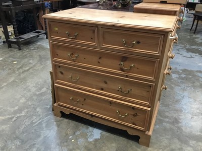 Lot 957 - Pine chest of two short and three long drawers with brass handles