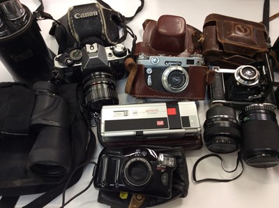 Lot 857 - Camera equipment to include Vivitar Macro Focusing Zoom lens 1:40, other camera lenses, cine camera, three pairs of binoculars and similar equipment