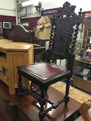 Lot 877 - Victorian carved oak hall chair with embossed leather back