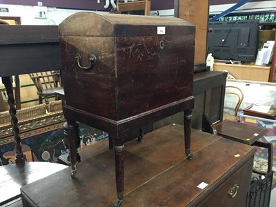 Lot 892 - George III mahogany cellarette with domed top,on ring turned legs on gilt brass castors