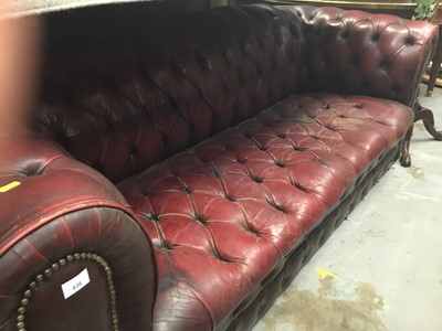 Lot 936 - Old red buttoned leather Chesterfield settee