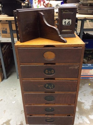 Lot 335 - Vintage office nest of drawers, mahogany wall bracket and desk calendar