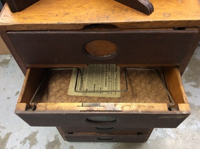 Lot 335 - Vintage office nest of drawers, mahogany wall bracket and desk calendar