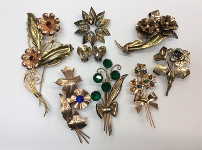 Lot 666 - Group seven stylised floral gem set brooches, all stamped sterling and pair clip on earrings