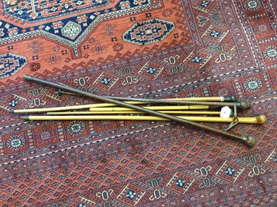Lot 98 - Silver mounted leather covered cane, similar riding whip and four other similar sticks and canes