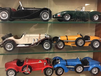 Lot 1568 - Two glazed cases of collectors cars