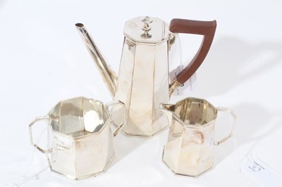 Lot 89 - George V Art Deco silver bachelors coffee set comprising coffee pot of tapered octagonal form, with angular spout, hinged cover and angular bakelite handle