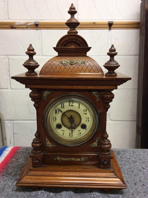 Lot 416 - Walnut mantle clock with brass decoration