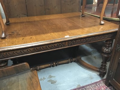 Lot 940 - Late 19th century French oak dining/ centre table with lions head corners , turned end standards joined by X frame , 97x 134cm