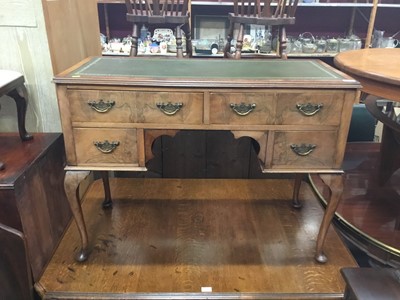 Lot 941 - 1950s walnut kneehole desk with lined top on cabriole legs 107 cm wide