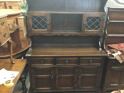 Lot 942 - Oak dresser with leaded glazed doors and linen fold decoration