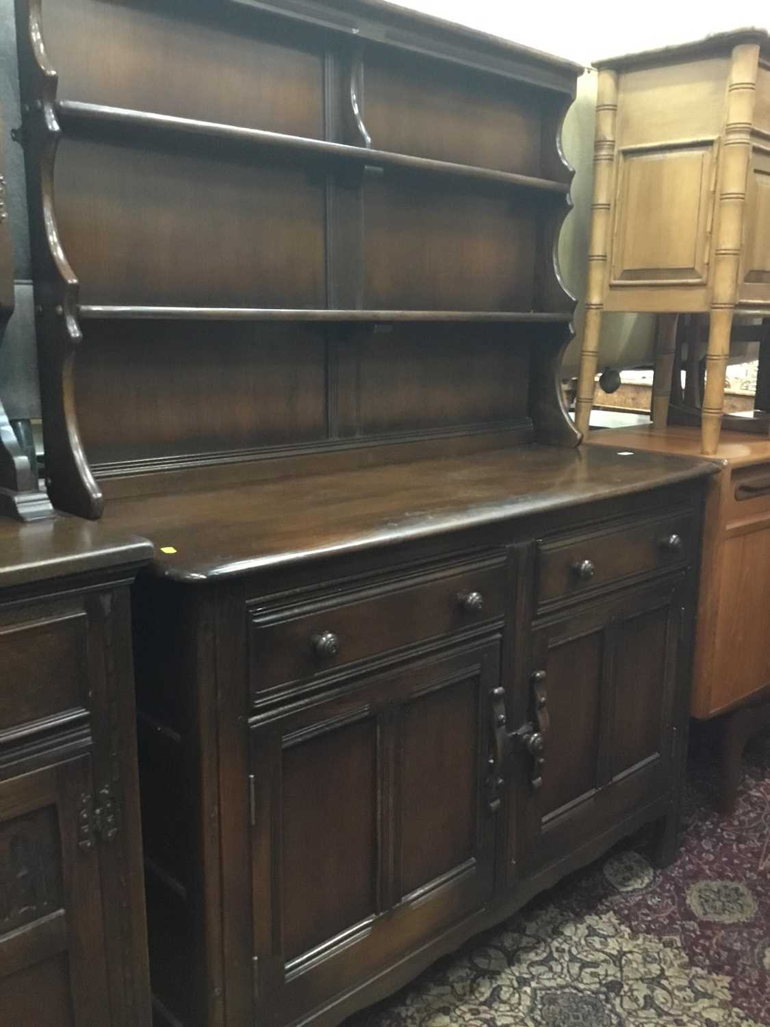 Lot 944 - Ercol style elm dresser with raised back,