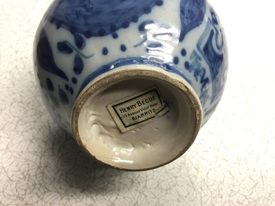 Lot 176 - Antique Continental blue and white jar, retailers label to base, together with an 18th century  salt glazed  flagon, with painted ornament