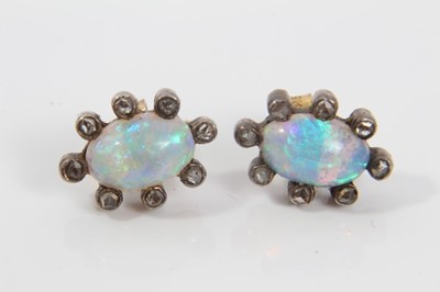 Lot 22 - Pair of antique opal and diamond earrings, each with a opal cabochon surrounded by rose cut diamonds in silver and gold setting