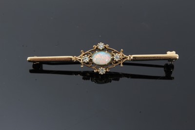 Lot 23 - Edwardian-style opal and diamond bar brooch with an oval cabochon opal and four single cut diamonds